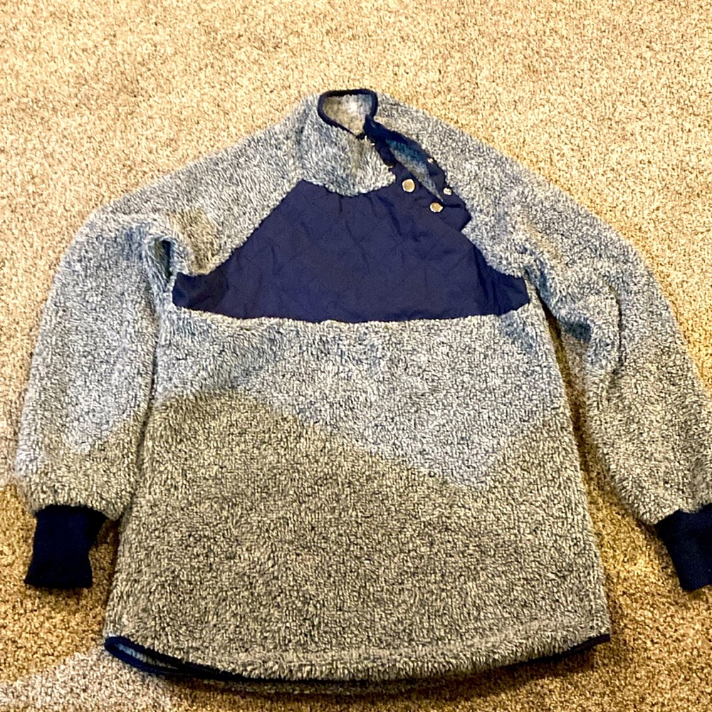 Fuzzy pullover with asymmetrical snap closure neckline